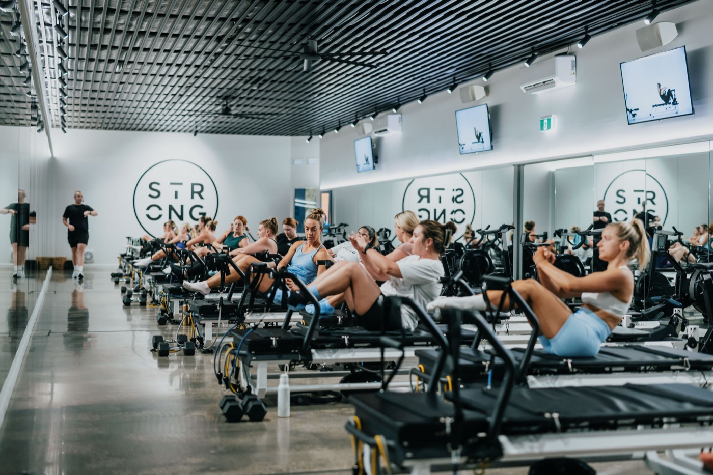 A full STRONG class mid-workout on the Rowformers