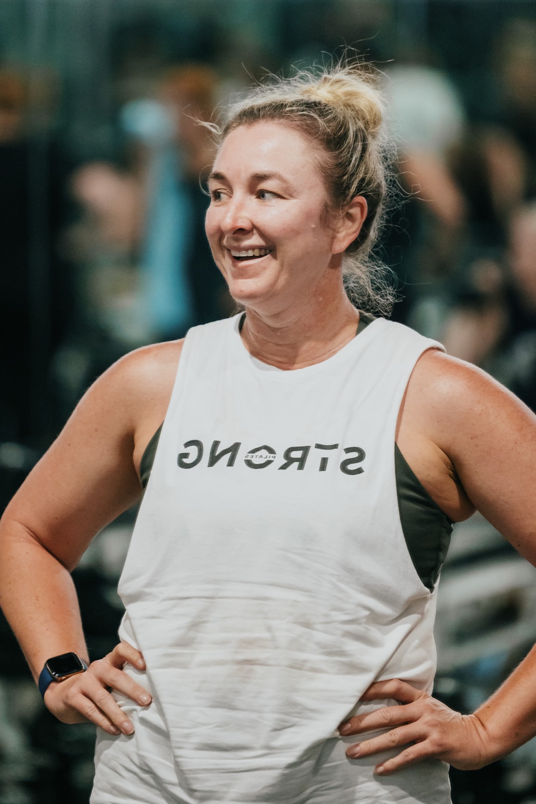 A smiling STRONG member in the studio